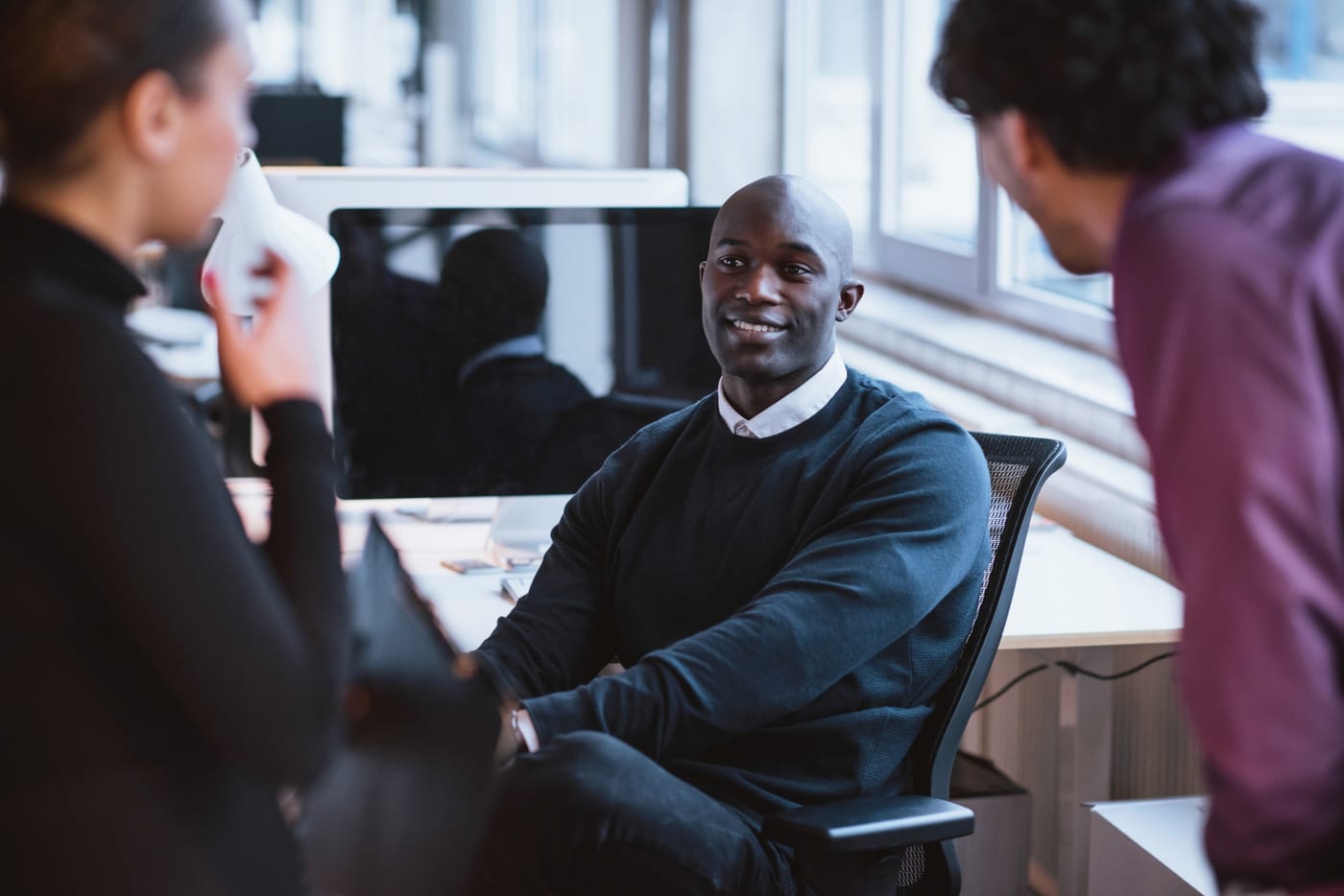 Executives talking through ideas together